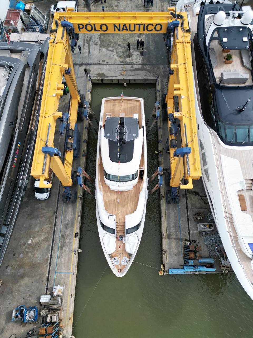 The yacht lowered into the water by travel lift, Polo Nautico Viareggio
